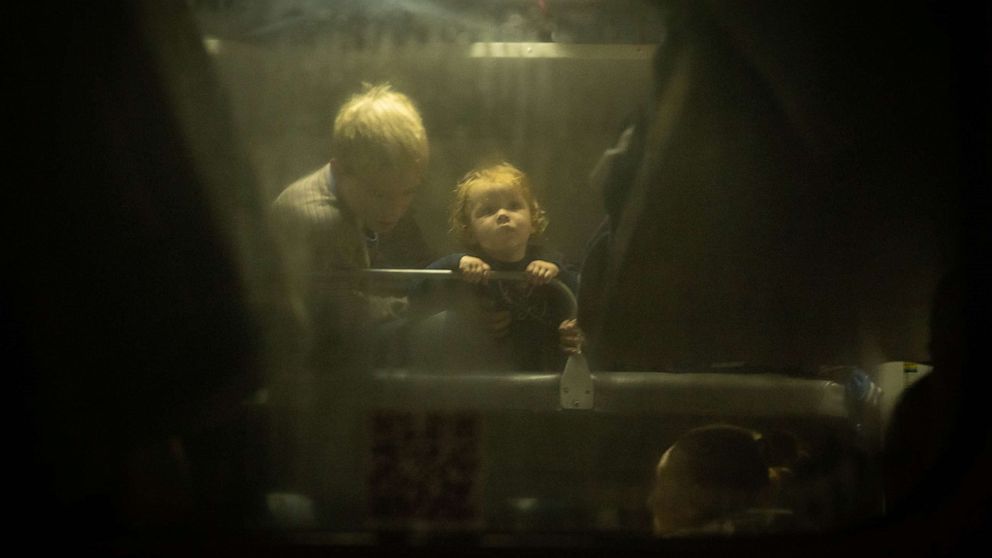 PHOTO: A child looks out from a bunk bed on board an evacuation train, Nov. 21, 2022 in Kherson, Ukraine.