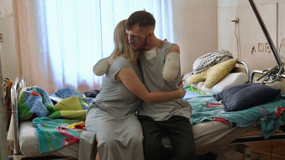 PHOTO: Alina and Andriy Smolensky sat down with ABC News' Foreign Correspondent James Longman in Kyiv on 21 July, 2023. Andriy lost both his arms, and his eyesight, when a shell exploded in front of him while in the trenches in the spring.