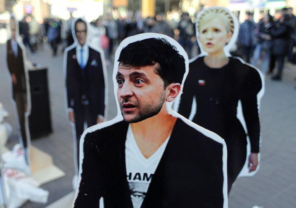 PHOTO: Cardboard images of presidential candidates Volodymyr Zelensky, foreground, and Yulia Tymoshenko, right, on display in central Kiev, Ukraine, Thursday, March 28, 2019. Ukraine will hold presidential elections on March 31.