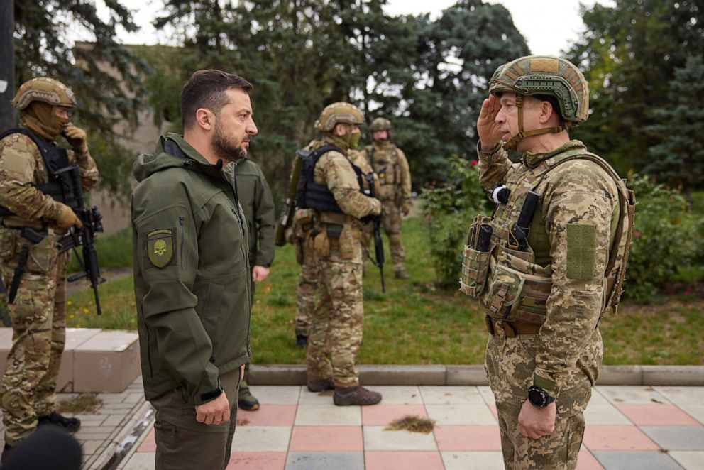 PHOTO: President Volodymyr Zelenskyy, left, listens to Col. Gen. Oleksandr Syrskiiys report during his visit in Izium, Kharkiv region, Ukraine, Sept. 14, 2022. 