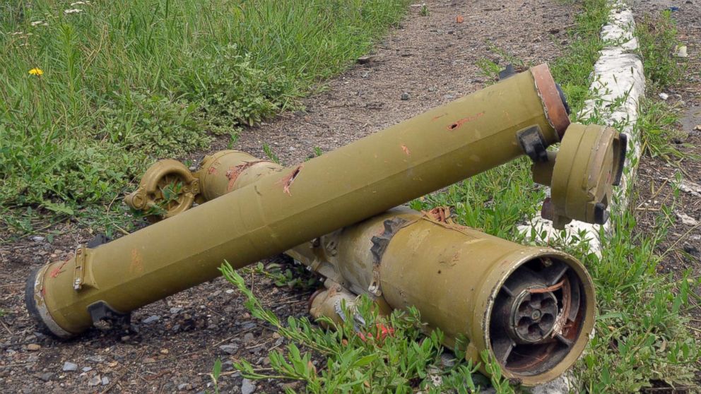 Tubes of portable anti-tank guided missiles lay near a parked ambulance in the village of Semyonovka, near the eastern Ukrainian city of Slavyansk, July 9, 2014, after fighting between Ukrainian forces and pro-Russian militants.