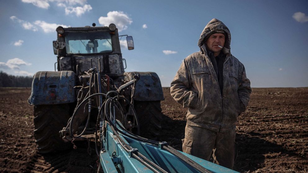PHOTO: Local farm worker Vladimir takes a break from ploughing a field near the village of Yakovlivka after it was hit by an aerial bombardment outside Kharkiv, as Russia's attack on Ukraine continues, April 5, 2022.
