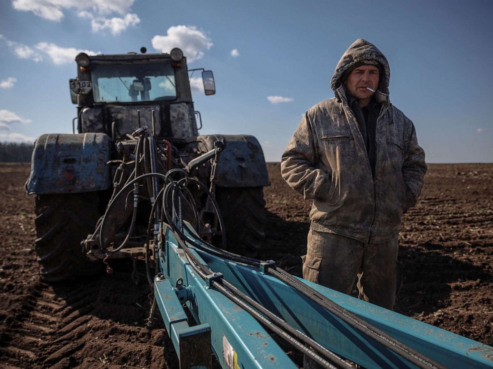 PHOTO: Local farm worker Vladimir takes a break from ploughing a field near the village of Yakovlivka after it was hit by an aerial bombardment outside Kharkiv, as Russias attack on Ukraine continues, April 5, 2022.