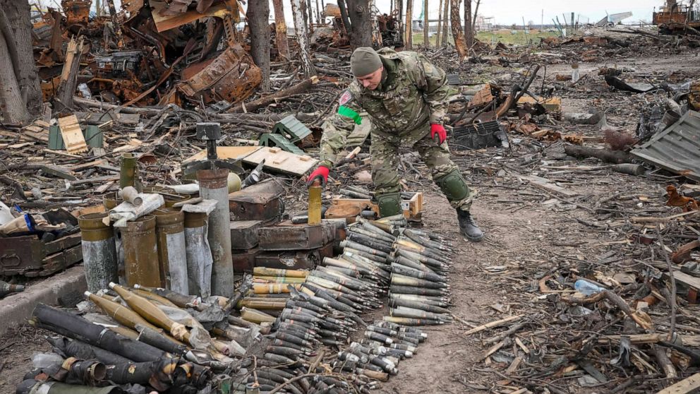 PHOTO: An Ukrainian interior ministry soldier collects unexploded shells, grenades and other devices in Hostomel, close to Kyiv, Ukraine, April 18, 2022.