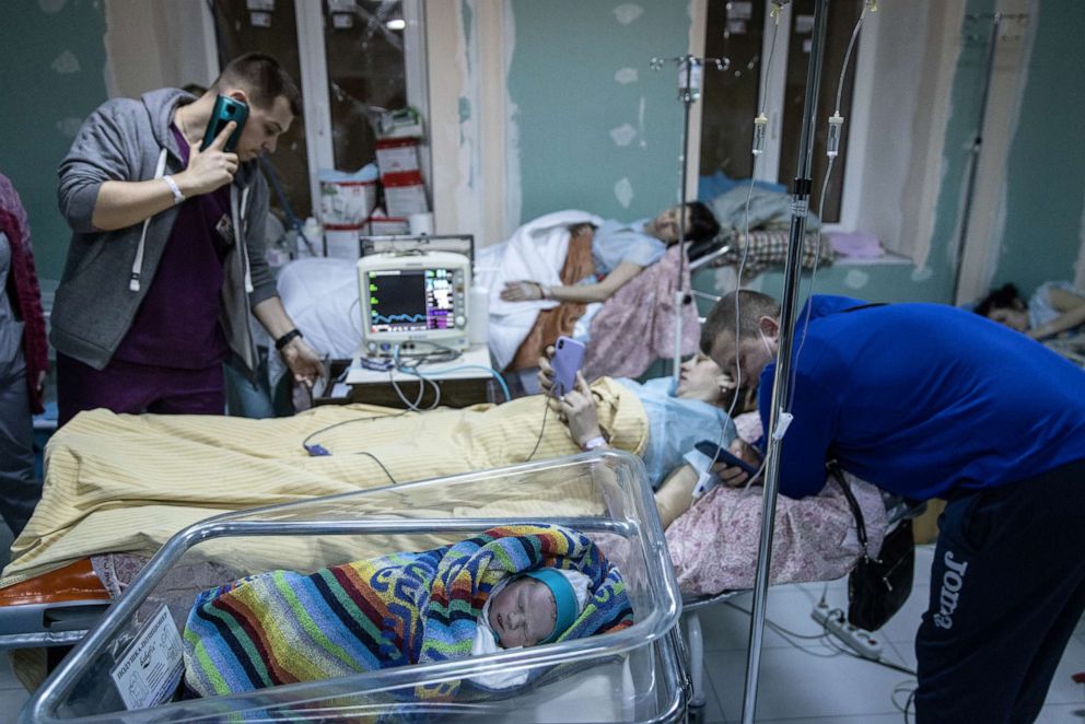 PHOTO: In this March 2, 2022, file photo, a newborn baby is seen in the bomb shelter of a maternity hospital in Kyiv, Ukraine.
