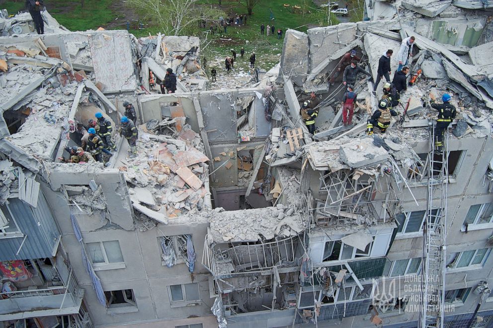 PHOTO: Rescuers work at a site of a residential building damaged by a Russian military strike in Sloviansk, Donetsk region, Ukraine, on April 14, 2023.