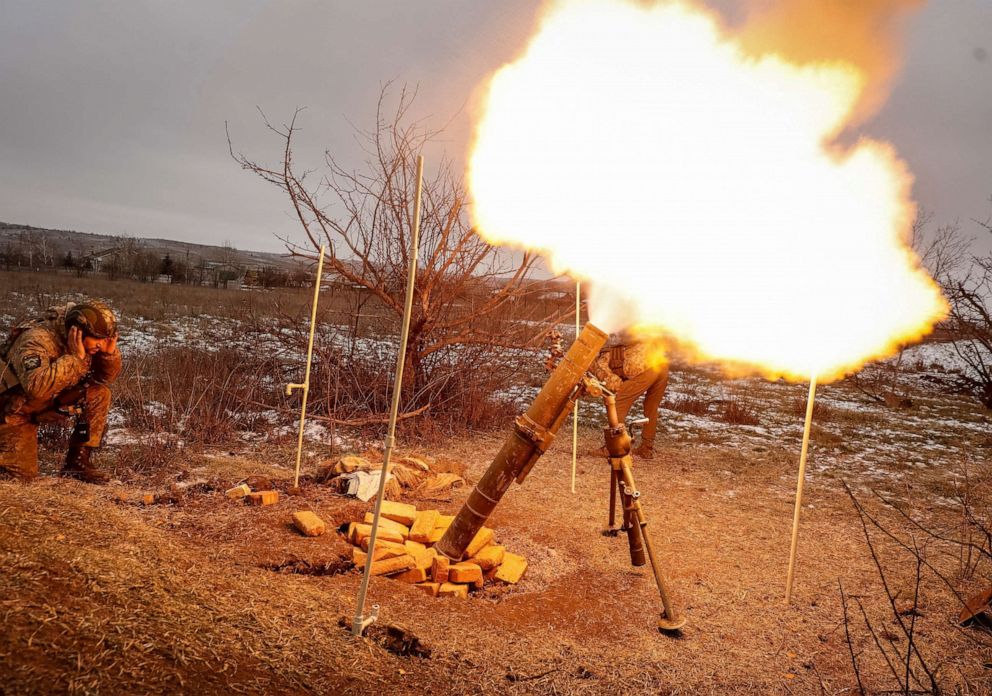 PHOTO: Ukrainian servicemen fire a mortar toward Russian positions, amid Russia's attack on Ukraine, on a front line near the town of Soledar in Donetsk region, Ukraine, Jan. 14, 2023.