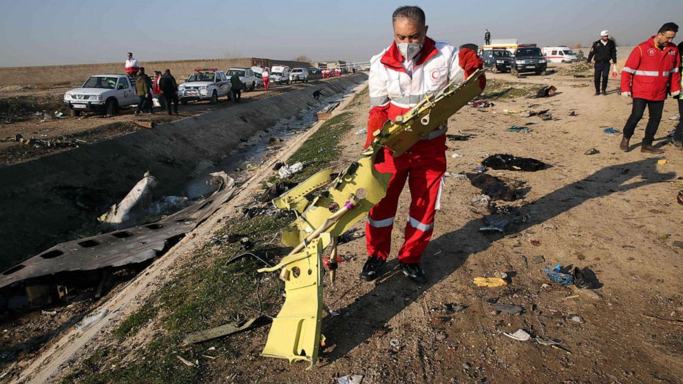 PHOTO: Rescue teams recover debris from a field after a Ukrainian plane carrying 176 passengers crashed near Imam Khomeini airport in the Iranian capital Tehran early in the morning on Jan. 8, 2020, killing everyone on board.