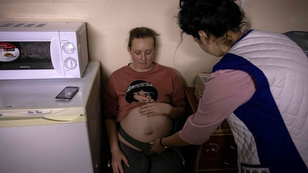 PHOTO: A pregnant woman is examined in the shelter of a maternity ward in the city of Zhytomyr, northern Ukraine, on March 23, 2022.