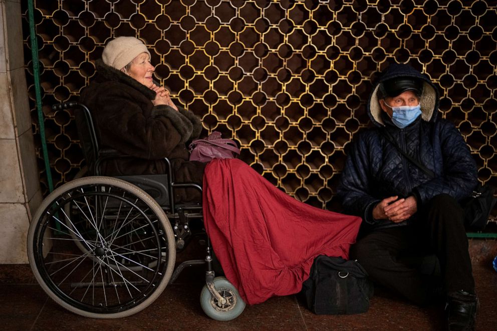 PHOTO: Vladimir, 70, and his wife Tamara, 80, sit in the Kyiv subway, using it as a bomb shelter in Kyiv, Ukraine, on Feb. 24, 2022.