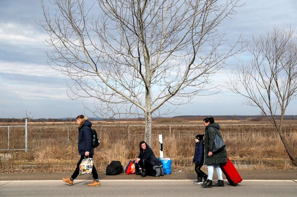 PHOTO: People flee from Ukraine to Hungary, after Russia launched a massive military operation against Ukraine, at a border crossing in Beregsurany, Hungary, Feb. 25, 2022.