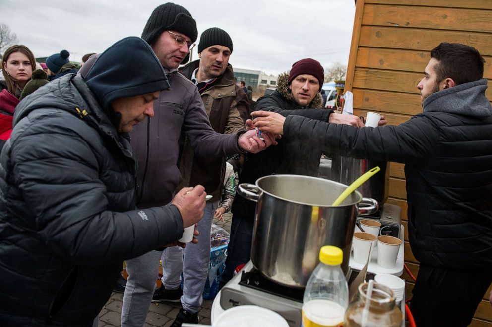 PHOTO: Ukrainian refugees are seen at the food distribution point at the border crossing in Medyka, Poland, Feb. 25, 2022.