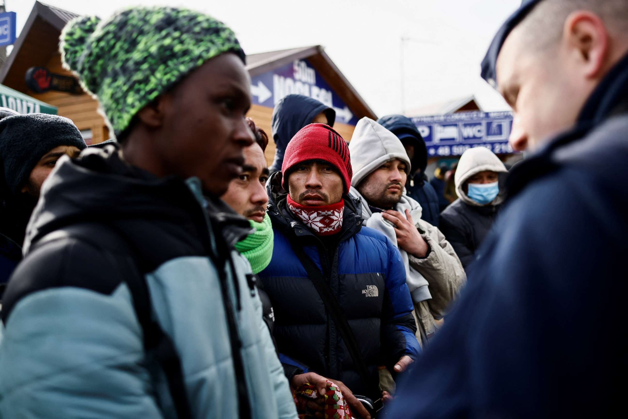 PHOTO: People who have fled the Russian invasion in Ukraine, wait to board a bus bound for a refugee centre established in Przemysl, in Medyka, Poland, March 1, 2022.