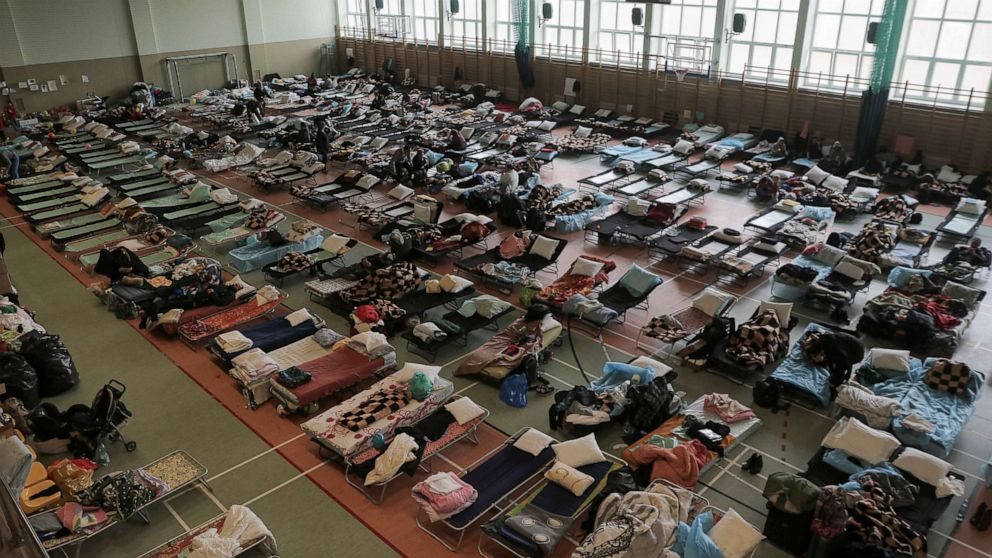 PHOTO: Hundreds of beds are placed inside a sports hall to accommodate Ukrainian refugees fleeing Russian invasion at the border crossing town of Medyka, Poland, March 1, 2022.