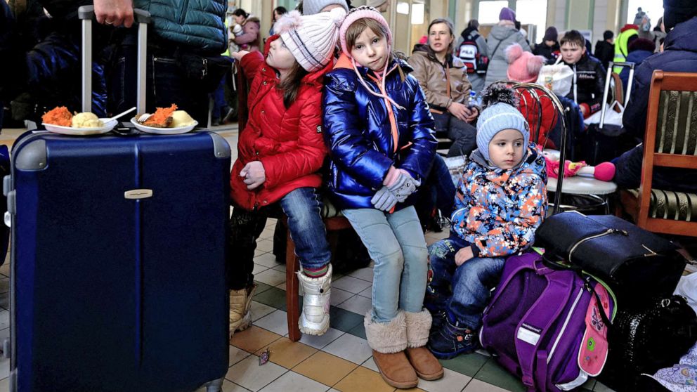 PHOTO: Refugee children rest at a train station, after fleeing Russia's invasion of Ukraine, in Przemysl, Poland, March 17, 2022.