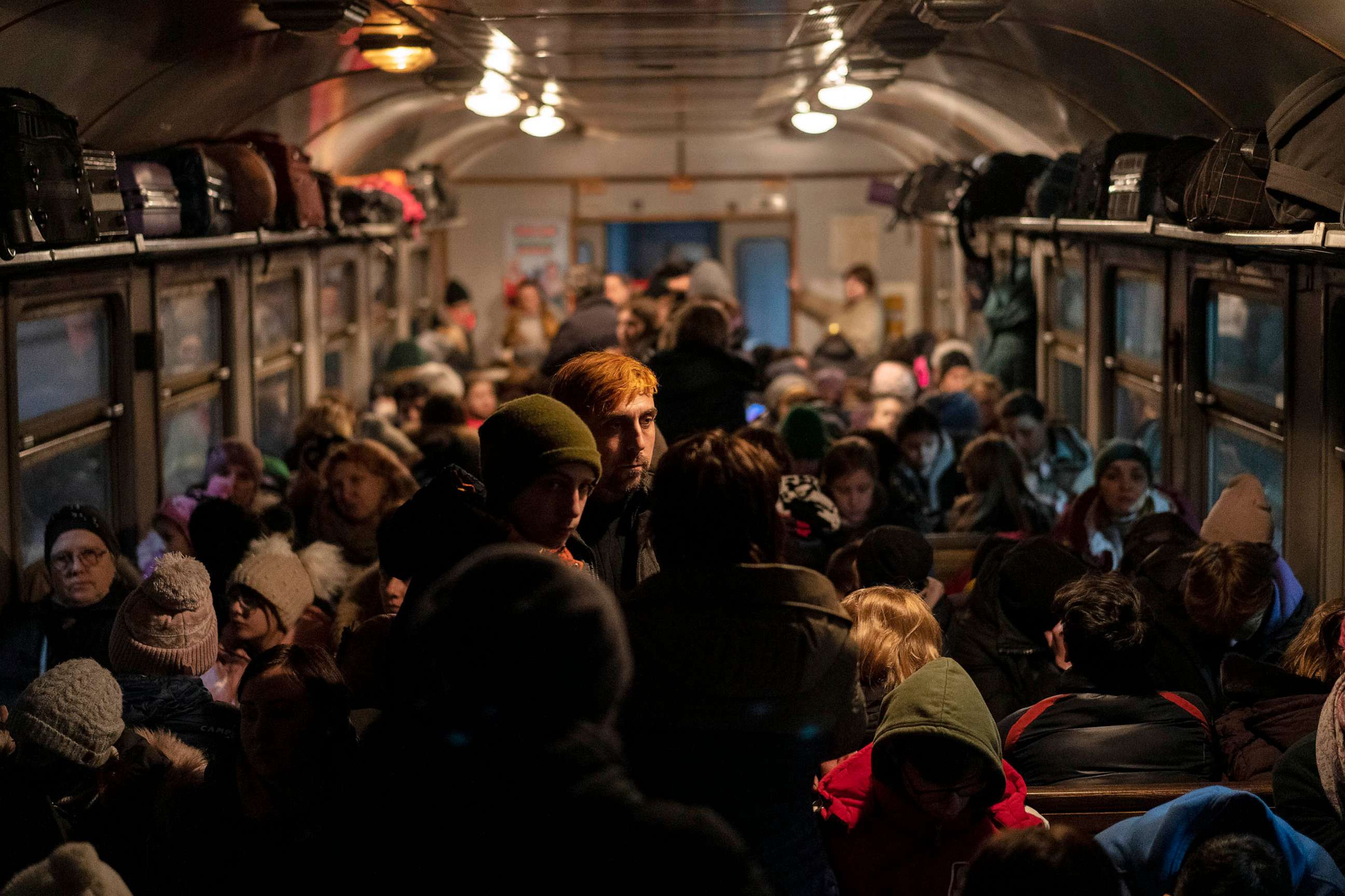 PHOTO: FILE - Displaced Ukrainians onboard a Poland bound train in Lviv, western Ukraine, March 13, 2022.