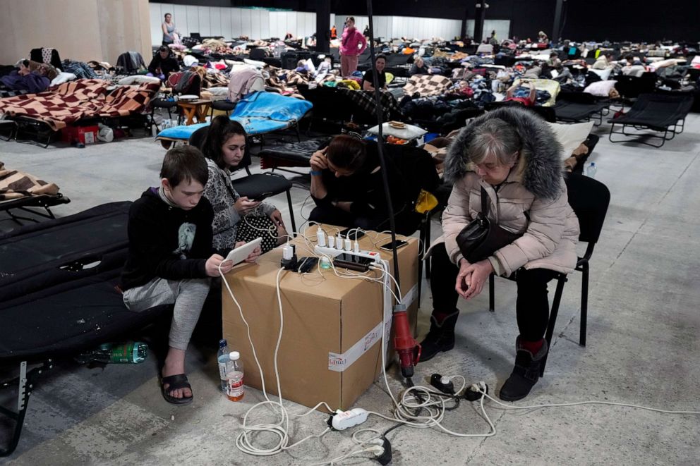 PHOTO: Ukrainians charge their electronic devices at a refugee shelter in Nadarzyn, near Warsaw, Poland, March 17, 2022.