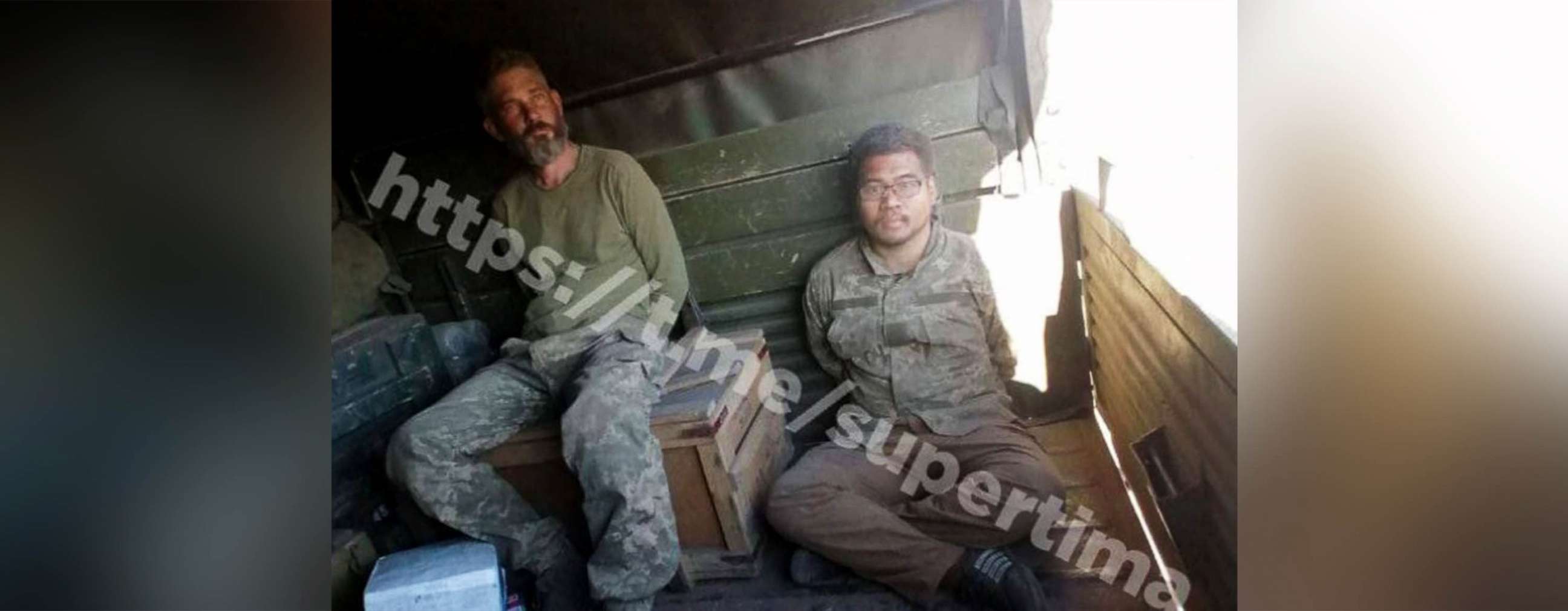 PHOTO: A photo that appears to show missing American soliders Alex Drueke and Andy Huynh in captivity is being circulated and is being investigated by the State Dept.