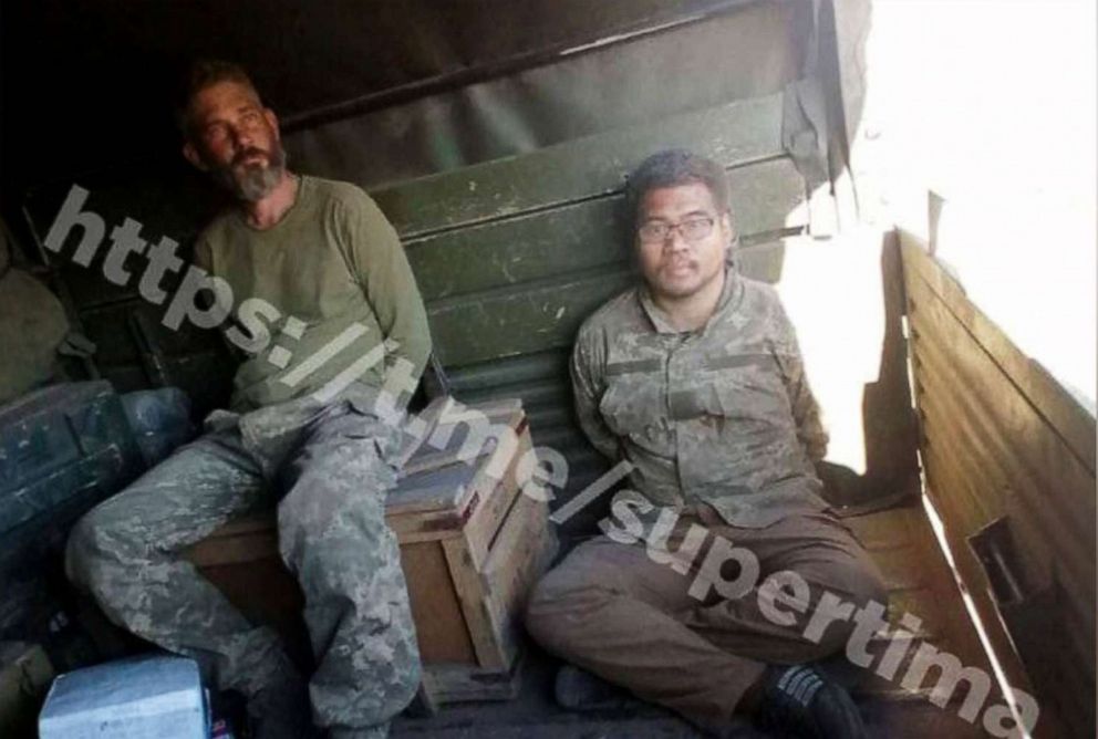 PHOTO: A photo that appears to show missing American soliders Alex Drueke and Andy Huynh in captivity is being circulated and is being investigated by the State Dept.