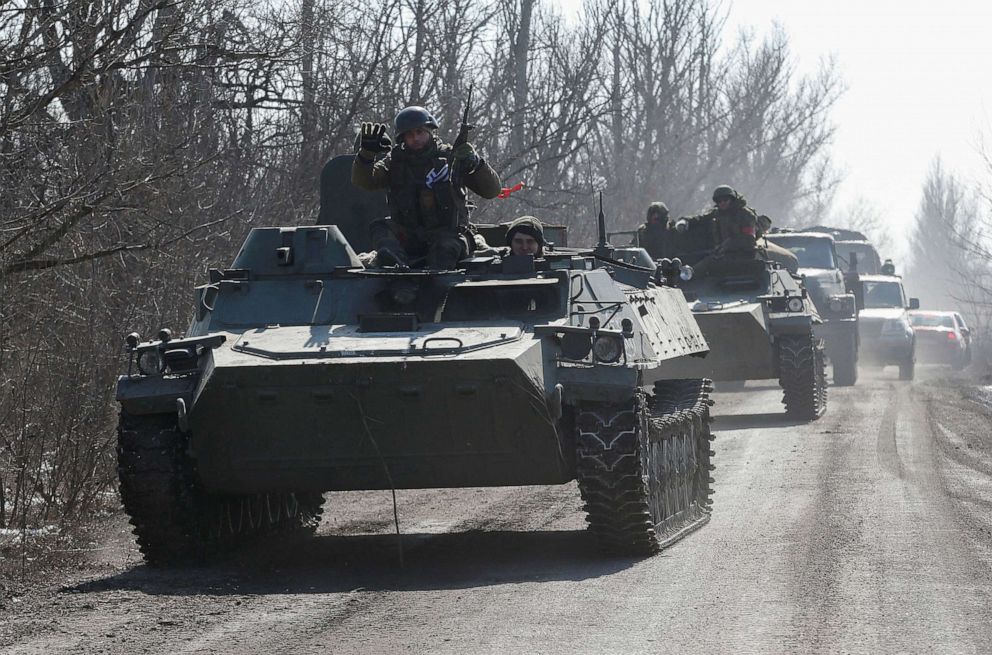 PHOTO: Service members of pro-Russian troops in uniforms without insignia are seen atop of armored vehicles during Ukraine-Russia conflict outside the separatist-controlled town of Volnovakha in the Donetsk region, Ukraine March 12, 2022. 