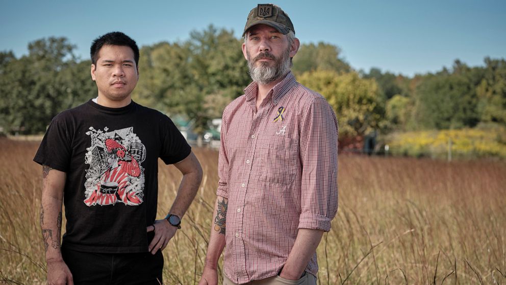 PHOTO: Andy Huynh and Alex Drueke, two Americans who were released earlier this month in the massive Russian-Ukraine prisoner swap, pose for a portrait together outside of Huynhs home in Trinity, Ala., Sept. 29, 2022.