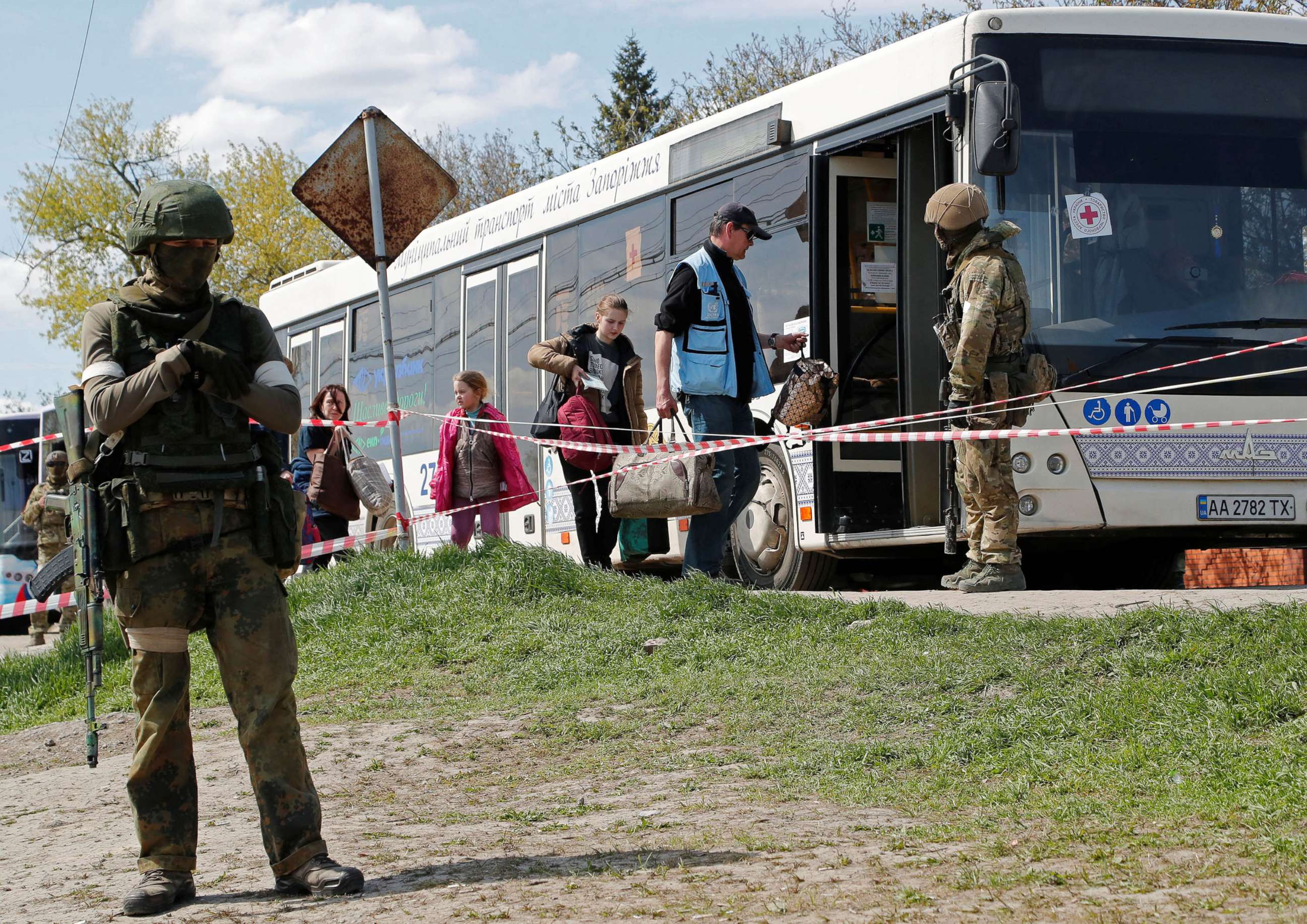 PHOTO: Civilians who left the area near Azovstal steel plant in Mariupol board a bus accompanied by a UN staff member near a temporary accommodation centre in the village of Bezimenne in the Donetsk Region, Ukraine May 1, 2022.