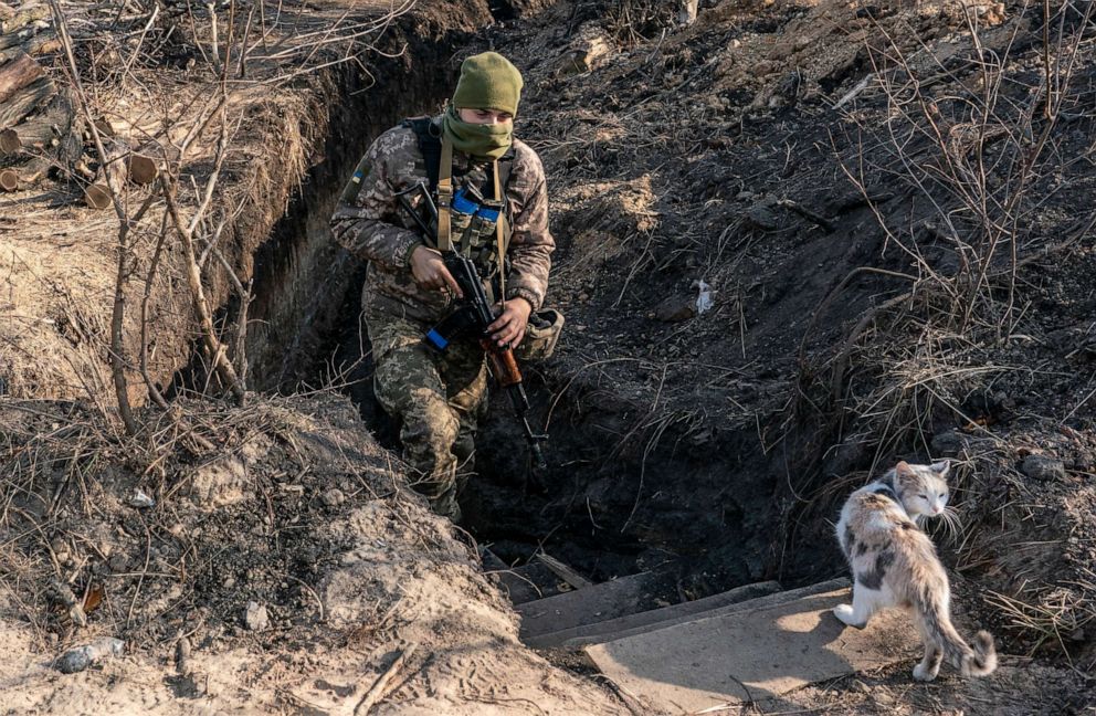 PHOTO: FILE- In this Nov. 2, 2019, file photo, a Ukrainian serviceman walks up from a trench at the new line of contact in Zolote, Luhansk region, eastern Ukraine. 