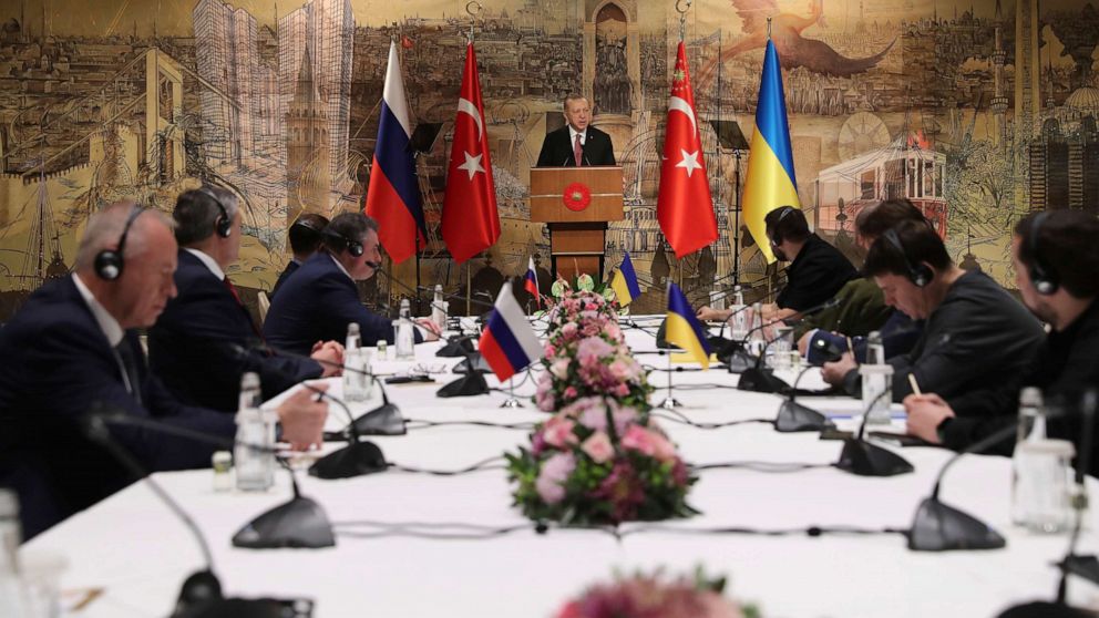 PHOTO: Turkey's President Recep Tayyip Erdogan gives a speech to welcome the Russian, left, and Ukrainian, right, delegations ahead of their talks in Istanbul on March 29, 2022.