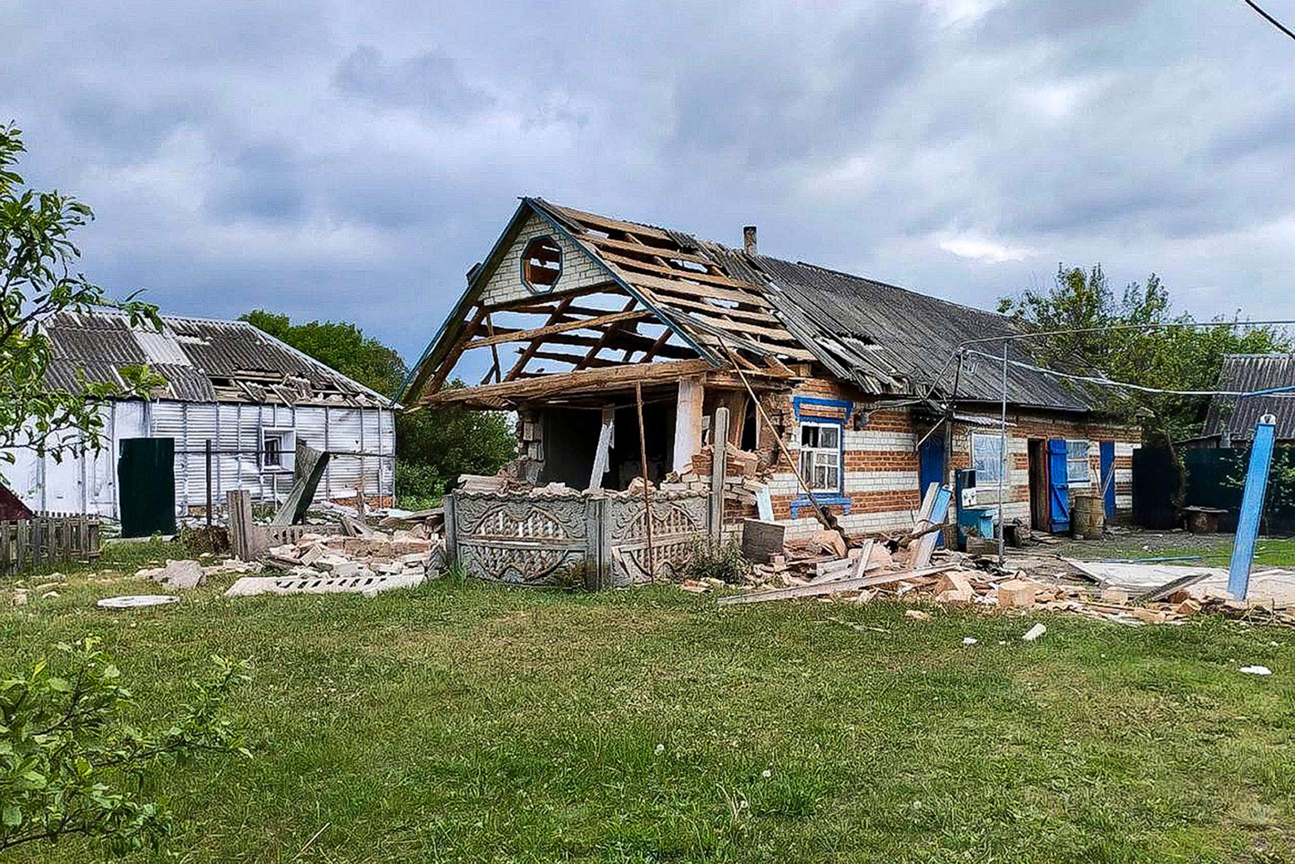 PHOTO: This handout photo released by Belgorod region governor Vyacheslav Gladkov's telegram channel on May 23, 2023, shows damaged houses in Russia's western Belgorod region, May 23, 2023.