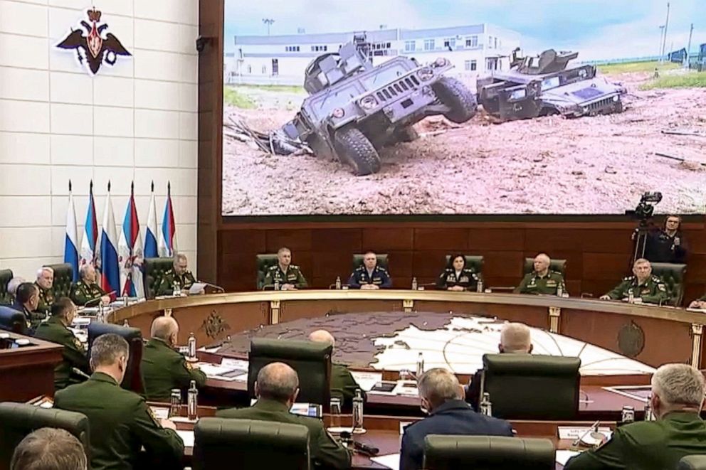 PHOTO: In this handout photo taken from video released by Russian Defense Ministry Press Service, Russian Defense Minister Sergei Shoigu, fourth left in the background, speaks during a meeting with high level officers in Moscow, Russia, May 24, 2023.
