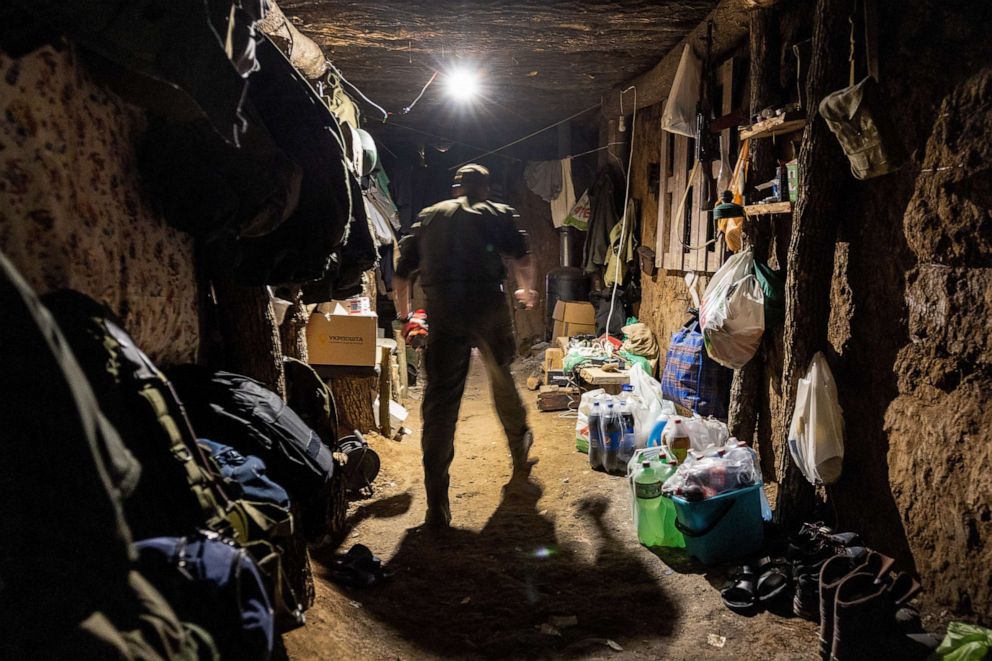 PHOTO: A Ukrainian national guard soldier walks through an underground bunker near a frontline position in Zelenodolsk, Ukraine, May 07, 2022.