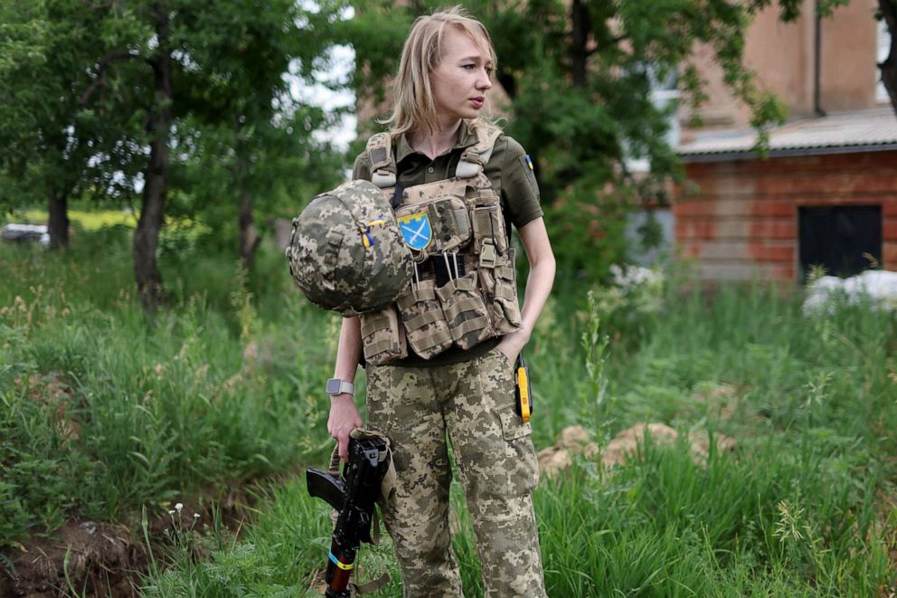 PHOTO: Svitlana, a member of Ukraine's Territorial Defense Forces, stands near a trench dug out to serve as a fighting position at her post near Kramatorsk, Ukraine, June 15, 2022
