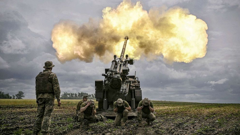 PHOTO: Ukrainian servicemen fire with a French self-propelled 155 mm/52-calibre gun Caesar towards Russian positions at a front line in the eastern Ukrainian region of Donbas on June 15, 2022.