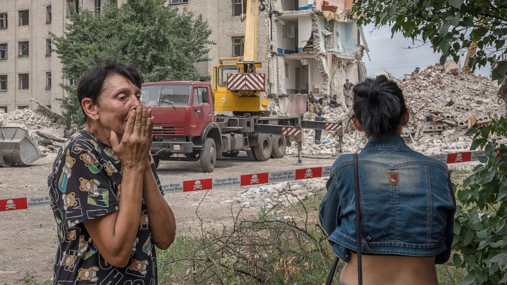 PHOTO: Iryna Shulimova, 59, weeps at the scene in the aftermath of a Russian rocket that hit an apartment residential block, in Chasiv Yar, Donetsk region, eastern Ukraine, July 10, 2022.
