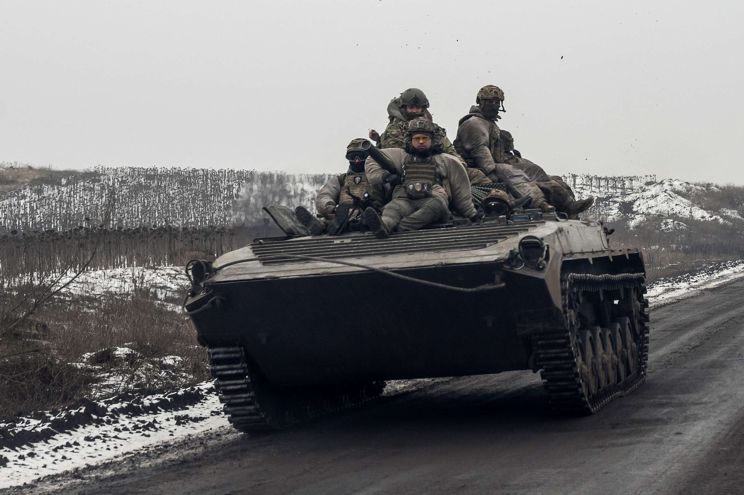 PHOTO: Ukrainian servicemen ride atop an infantry fighting vehicle along a road, amid Russia's attack on Ukraine, near a frontline in Donetsk region, Ukraine January 30, 2023.