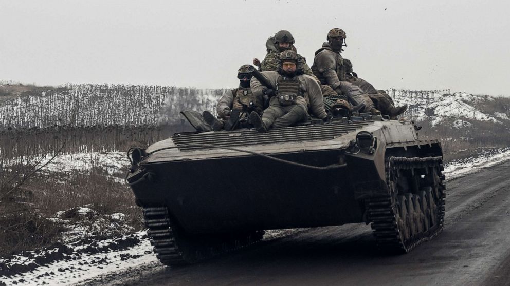 PHOTO: Ukrainian servicemen ride atop an infantry fighting vehicle along a road, amid Russia's attack on Ukraine, near a frontline in Donetsk region, Ukraine January 30, 2023.