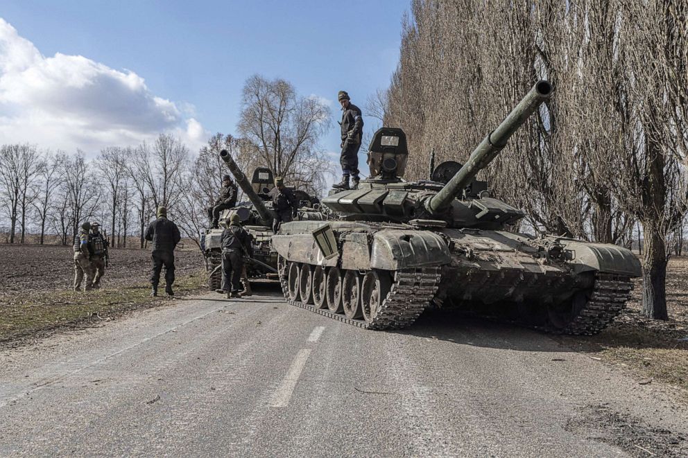 PHOTO: A Ukrainian serviceman sits inside a Russian tank captured after fighting with Russian troops in the village of Lukyanivka outside Kyiv, Ukraine, on March 27, 2022.
