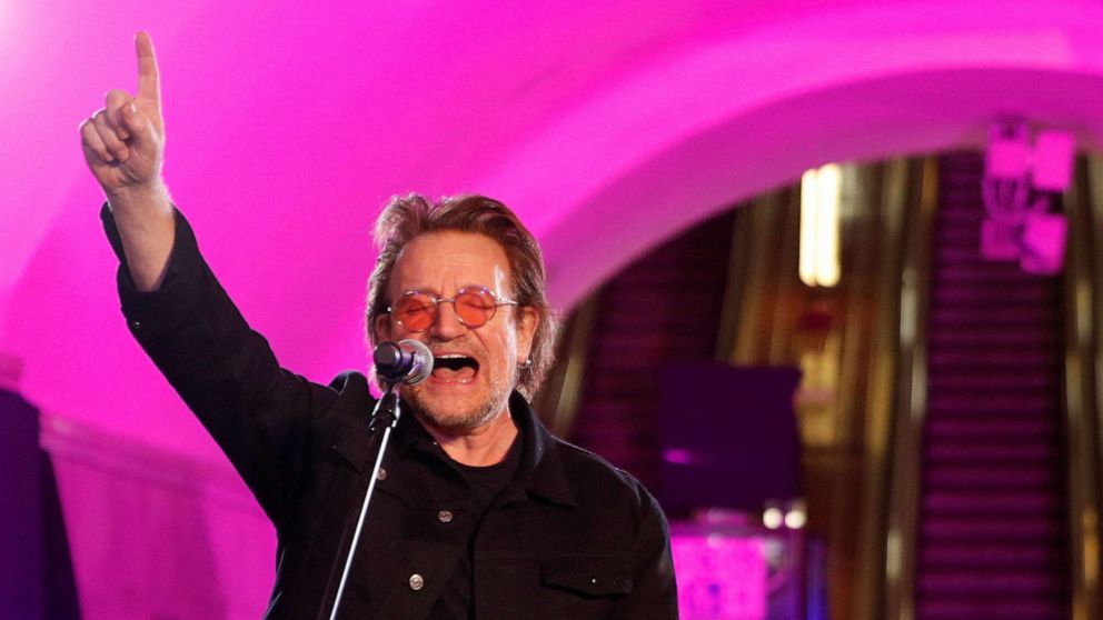 PHOTO: U2 rock band frontman Bono sings during a performance for Ukrainian people inside a subway station in Kyiv, Ukraine May 8, 2022. 