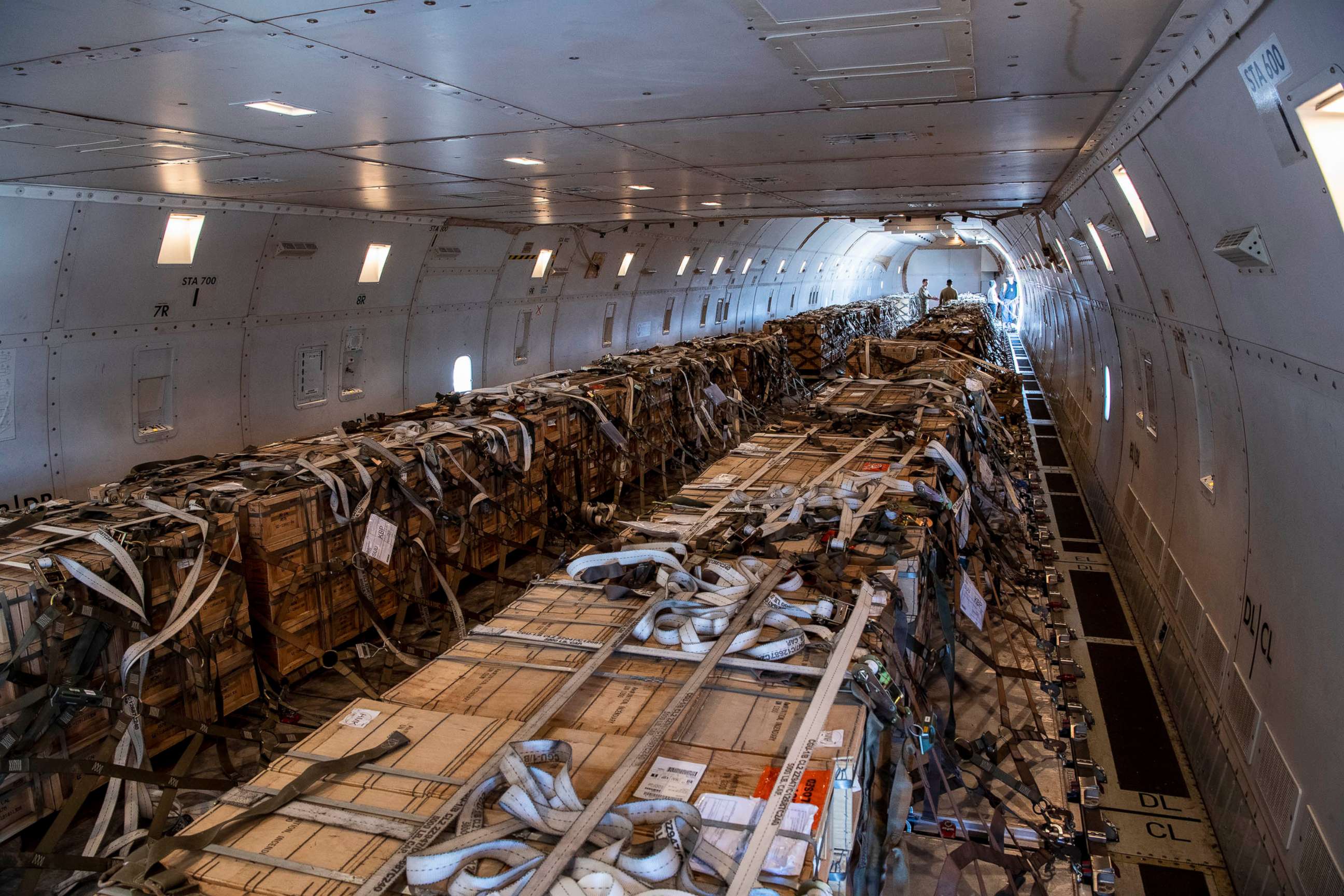 PHOTO: U.S. Air Force Airmen from the 60th Aerial Port Squadron load cargo on to a 757 at Travis Air Force Base, Calif., Jan. 22, 2022.