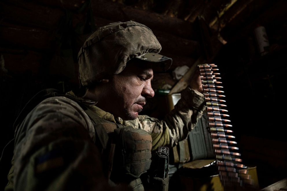 PHOTO: A Ukrainian serviceman of 28th prepares ammunition for the machine-gun at the frontline in Donetsk region, Ukraine, Wednesday, June 21, 2023.