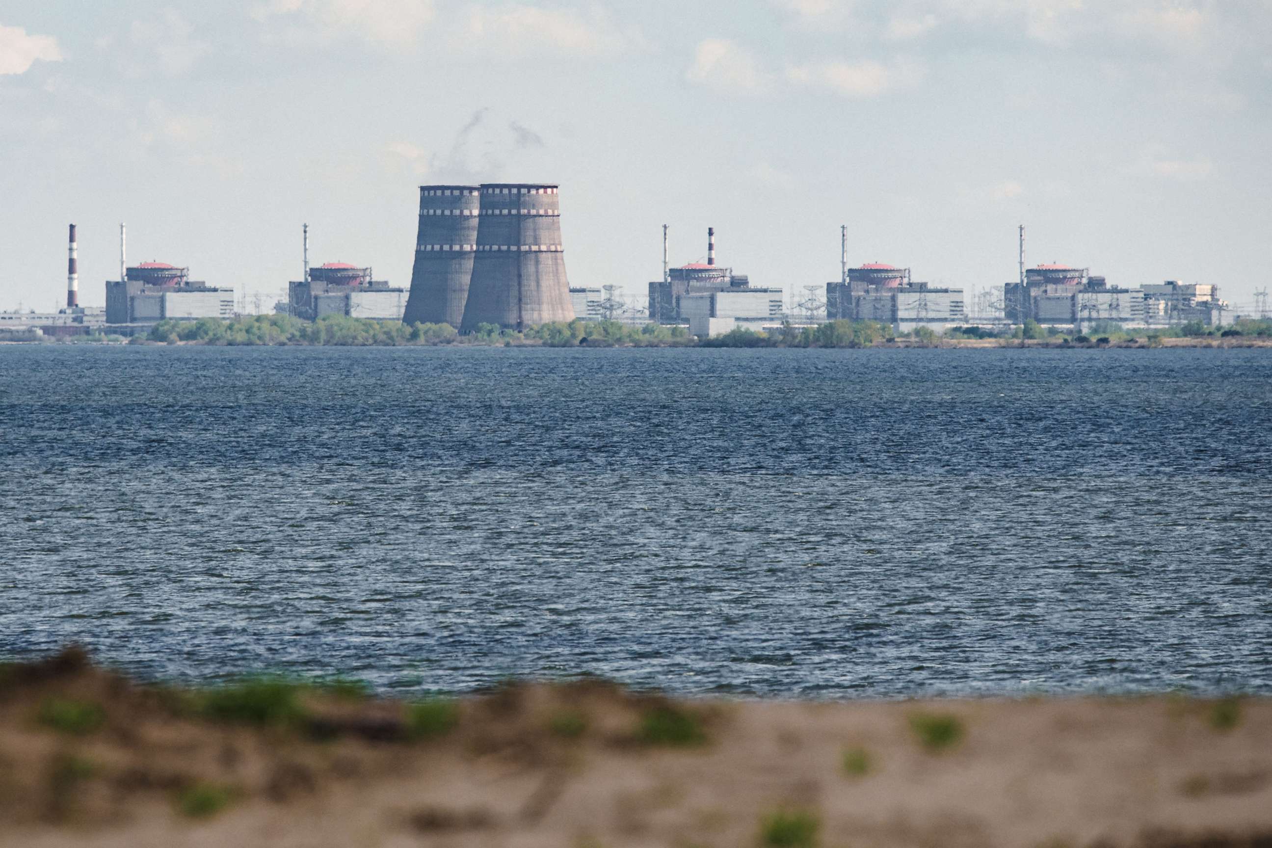 PHOTO: A general view  from Nikopol shows the Zaporizhzhia nuclear power plant, situated in Enerhodar, Ukriane, April 27, 2022. 