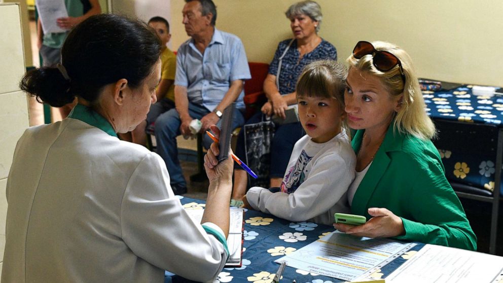 PHOTO: People receive iodine-containing tablets at a distribution point in Zaporizhzhia, Ukraine, Aug. 26, 2022. 