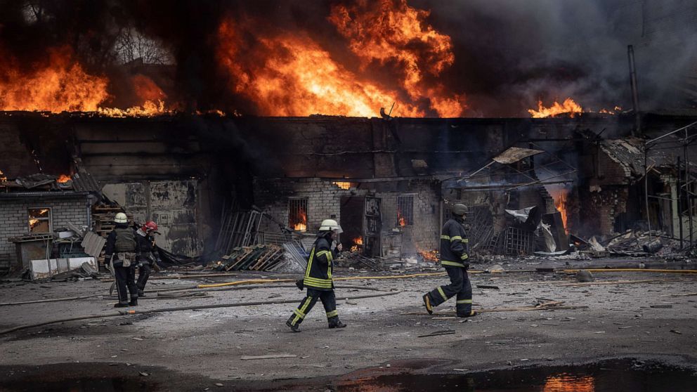 PHOTO: Firefighters work to extinguish a fire at a warehouse, March 28, 2022, in Kharkiv, Ukraine.