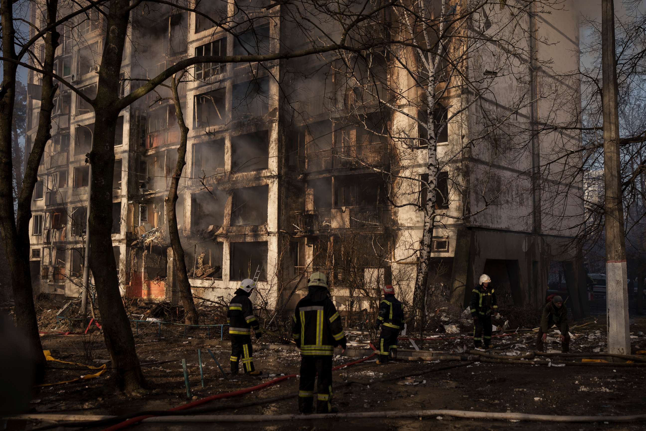 PHOTO: Firefighters work at the scene of an apartment building in Kyiv, Ukraine, March 15, 2022.