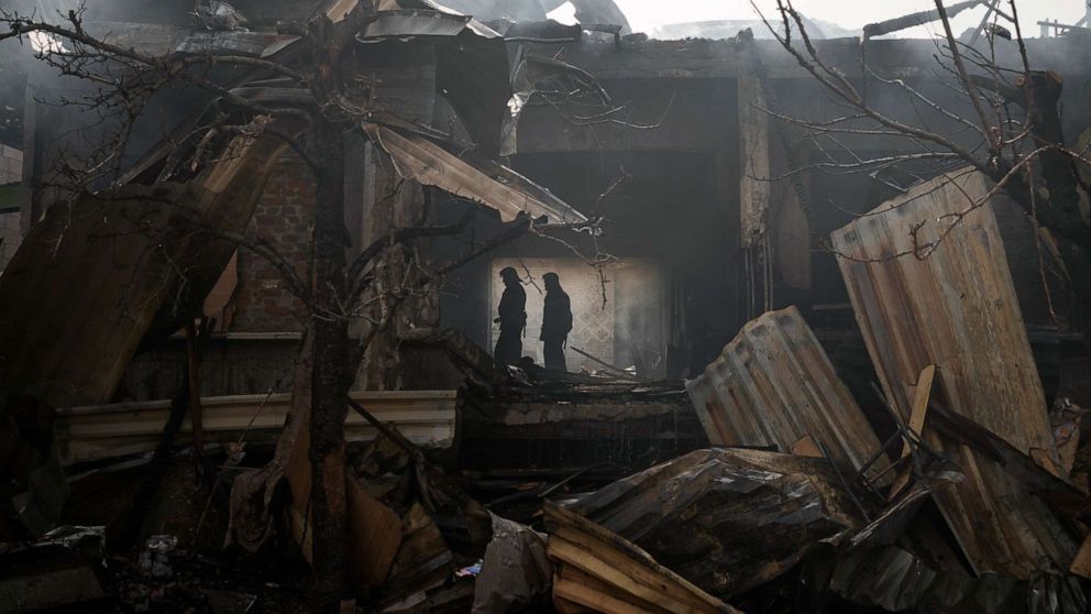 PHOTO: Firefighters work to extinguish a fire at a house in Kharkiv, Ukraine, April 11, 2022.