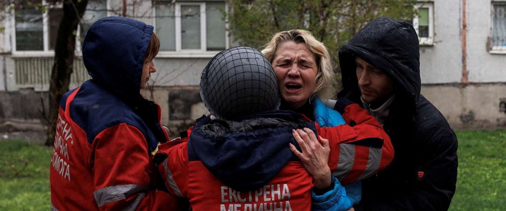 PHOTO: Yana Bachek mourns in the arms of a medical worker, after her father was killed by Russian shelling, as Russias attack on Ukraine continues, in Kharkiv, Ukraine, April 18, 2022.