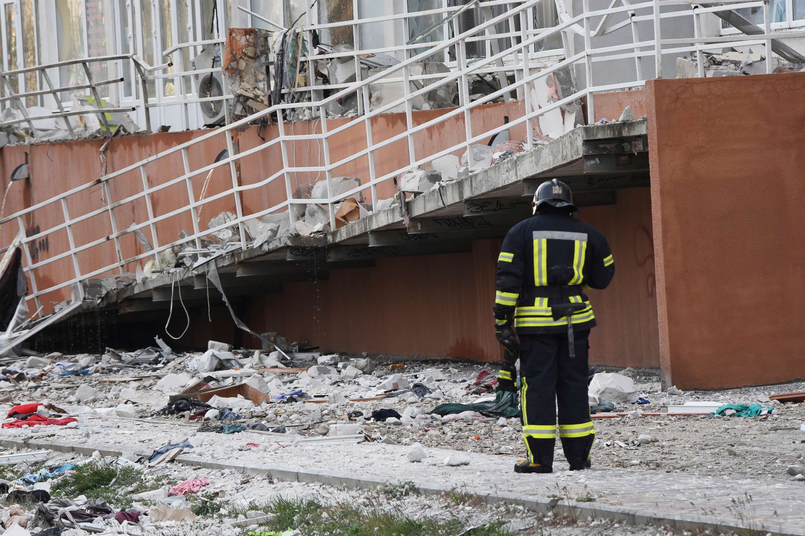 PHOTO: A firefighter stands next to an apartment building damaged in Odesa, Ukraine,  April 23, 2022.