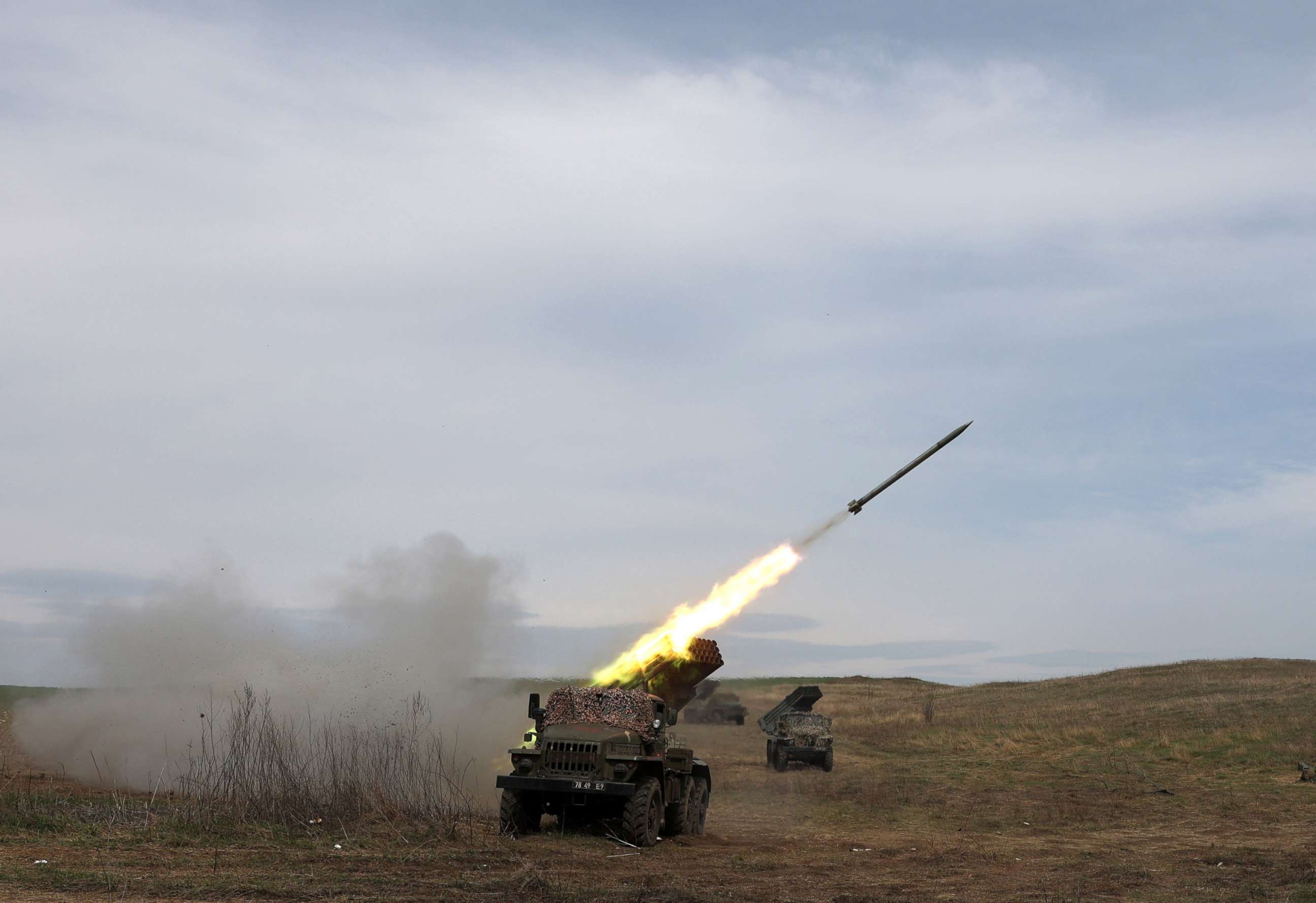 PHOTO: A Ukrainian multiple rocket launcher BM-21 "Grad" shells Russian troops' position, near Lugansk, in the Donbas region, on April 10, 2022.