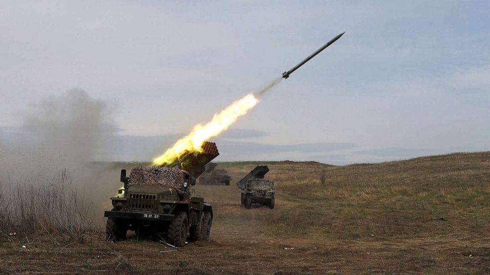 PHOTO: A Ukrainian multiple rocket launcher BM-21 "Grad" shells Russian troops' position, near Lugansk, in the Donbas region, on April 10, 2022.