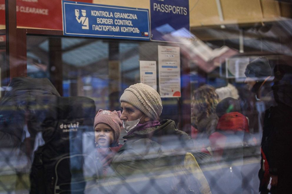 PHOTO: Ukrainian wait in the passport control area after exiting a train arriving from Odessa at Przemysl main train station on Feb. 25, 2022 in Przemysl, Poland.